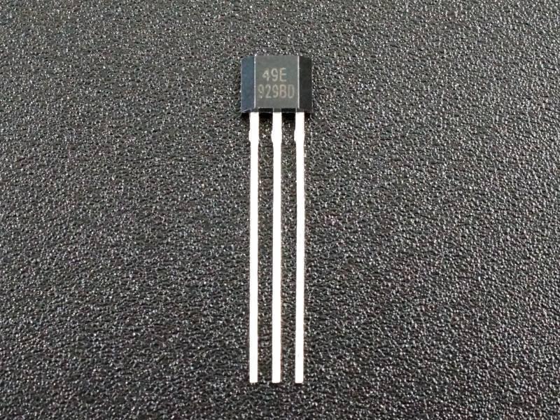 Linear Hall Effect Sensor 49E OH49E SS49E Hall Element - a black three-pin electronic component with the text "49E 929BD" printed on its front face, shown against a textured background.