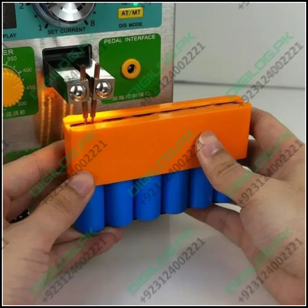 Lithium Battery Fixture Single Row Double-sided 18650 Battery Spot Welding Fixer Battery Pack Fast Welding Fixed Bracket G8tb - shown holding a row of blue batteries under a spot welder's probes.