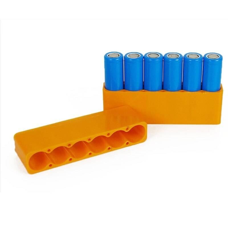 Lithium Battery Fixture Single Row Double-sided 18650 Battery Spot Welding Fixer Battery Pack Fast Welding Fixed Bracket G8tb - six blue cylindrical batteries inside an orange plastic bracket.
