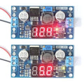 LM2596 2A Buck Step-down Power Converter Module DC 4.0~40 To 1.3-37V LED Voltmeter - two blue circuit boards with red LED displays, screw terminals, and a small button.