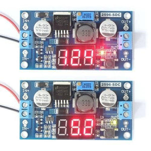 LM2596 2A Buck Step-down Power Converter Module DC 4.0~40 To 1.3-37V LED Voltmeter - two blue circuit boards with red LED displays, screw terminals, and a small button.