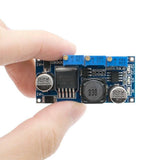 LM2596 DC-DC Step Down Cc Cv Power Supply Module LED Driver Battery Charger Adjustable LM2596S Constant Current Voltage - a blue circuit board with three adjustable potentiometers, a large inductor, and capacitors.