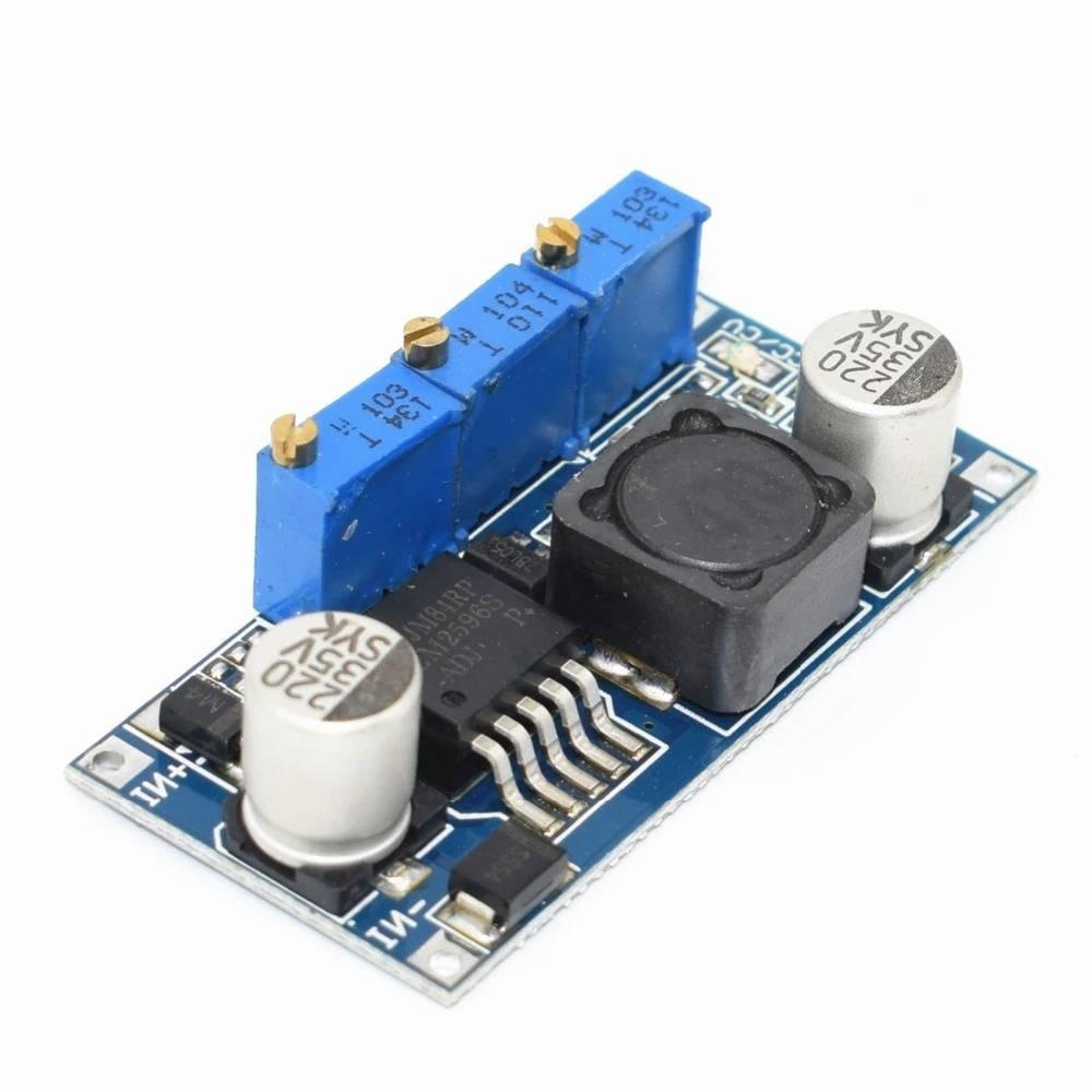 LM2596 DC-DC Step Down Cc Cv Power Supply Module LED Driver Battery Charger Adjustable LM2596S Constant Current Voltage - a blue circuit board with three adjustable potentiometers, a black inductor, two capacitors, and input terminals.