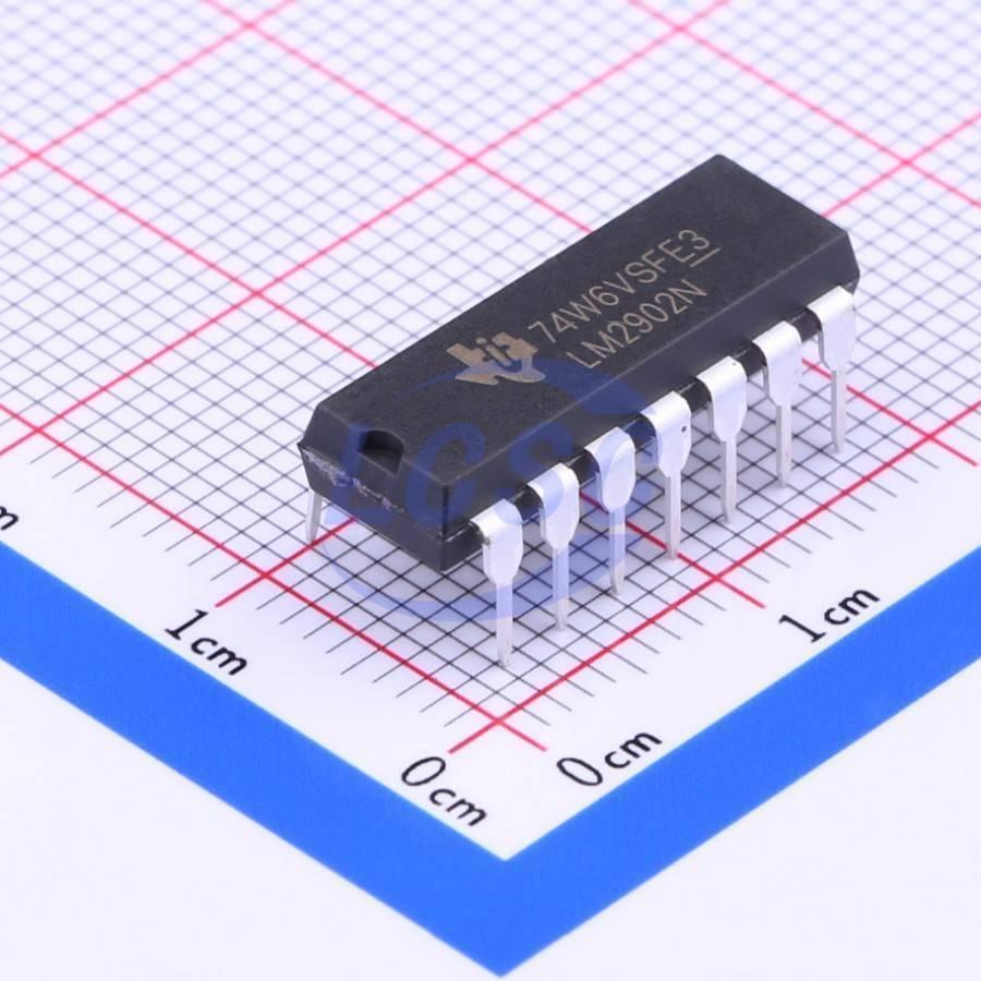 LM2902N Operational Amplifier IC - shown as a black, rectangular 14-pin dual in-line package resting on a white grid surface for scale.