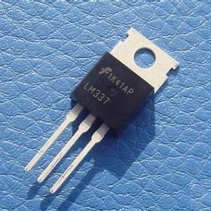 LM337 Adjustable -ve Voltage Regulator - a black three-pin electronic component with a metal heat sink tab, shown against a textured blue background.