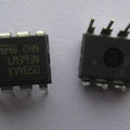 LM393 Dual Differential Comparator IC - shown as two black, eight-pin integrated circuit chips with white text markings on a plain white background.