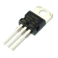 LM7806 - L7806CV, a black three-pin voltage regulator component with a metal mounting tab and printed text, shown from an angled perspective.