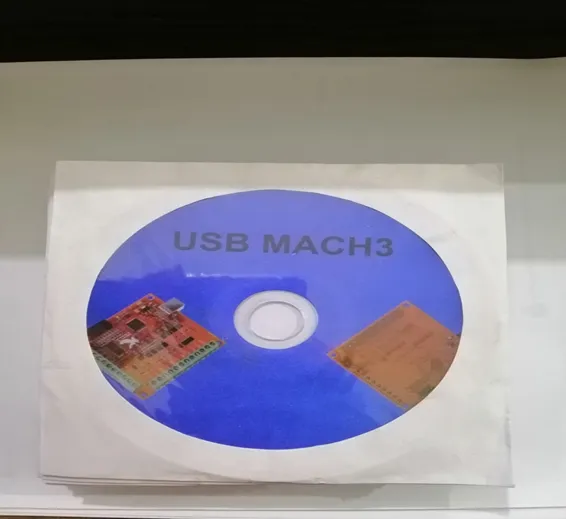 Mach3 CNC Software Cd | USB Installation Disc For CNC Controllers - a blue circular disc featuring printed text and images of circuit boards, enclosed in a white paper sleeve.