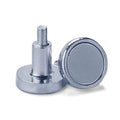 Magnet - two silver-colored cylindrical magnetic fasteners with threaded metal studs, shown in a close-up against a white background.
