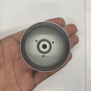 Magnet for storing screws and metal - a circular silver-toned metallic bowl with a dark magnetic rim held in a palm.