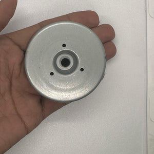 Magnet for storing screws and metal - shown as a silver, circular metal disc with a central hole and three small holes arranged around the center.