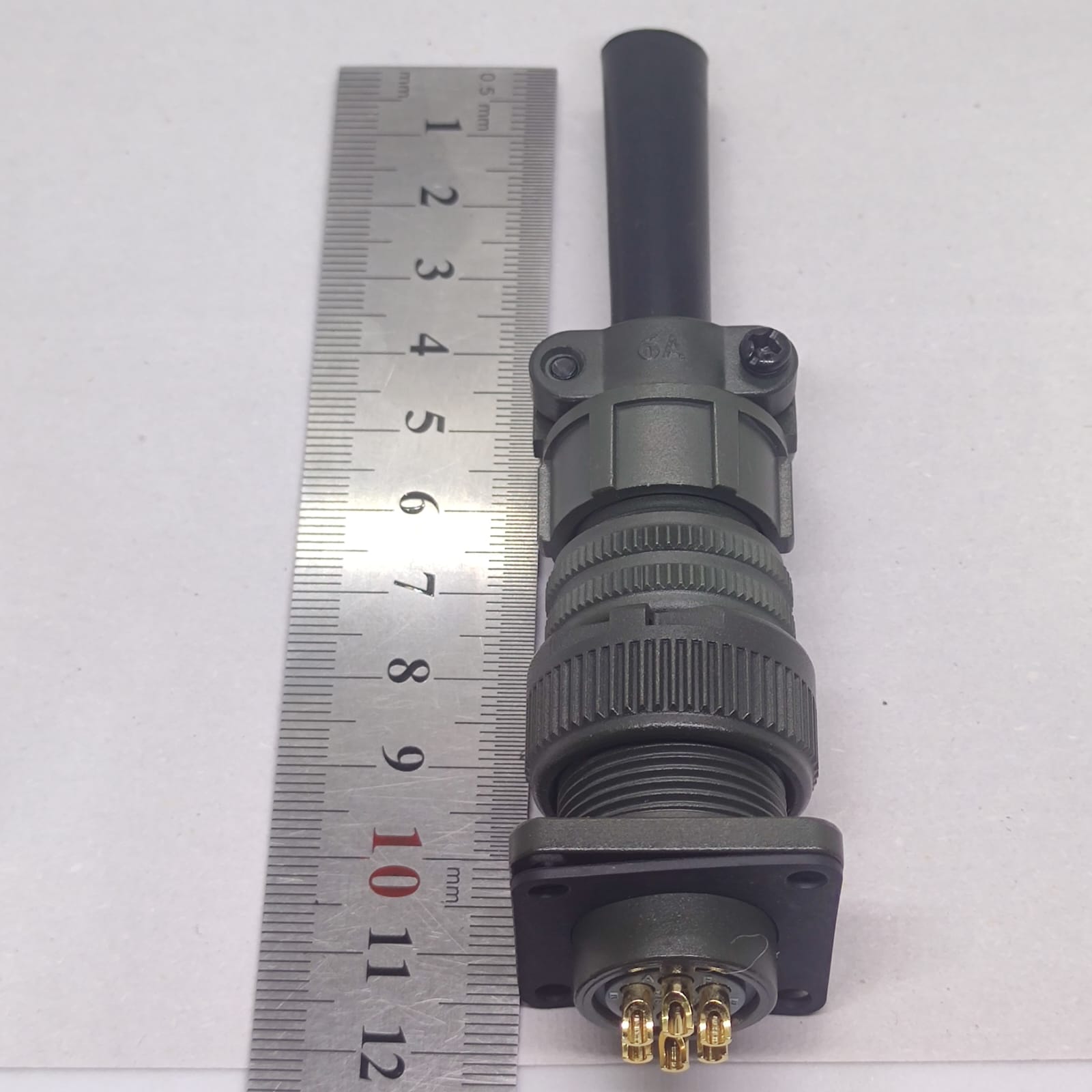 Maojwei IS09001 14S-6p Military Connector - shown next to a metal ruler for scale, featuring a green cylindrical housing and a six-pin circular connector.