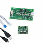 MAX30101/ MAX30102 Accevkit - two green circuit boards, a flat ribbon cable, and a USB cable on a white background.