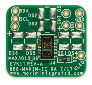 MAX30101/ MAX30102 Accevkit - a green square printed circuit board featuring a central sensor, labeled pins for SDA, SCL, INT, VDD, GND, and VLED.