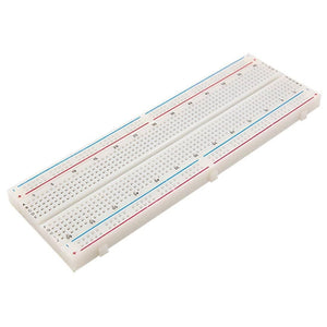 MB102 Breadboard 830 Points Solderless Prototyping Breadboard High Quality - with 830 tie points, shown at an angle with its numbered contact rows and red and blue power rails along both edges.
