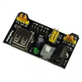 MB102 Breadboard Power Supply Module 3.3V/5V For Arduino Solderless Bread Board - a black circuit board featuring a USB port, a DC power jack, a power switch, two yellow jumpers, and pins.