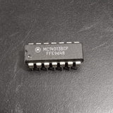 MC14013BCP Dual D-Type Flip-Flop IC - a black 14-pin integrated circuit chip with white text markings on its surface, shown in a top-down close-up view.