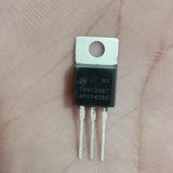 MC78M12ABT 12V 500mA Voltage Regulator - a black three-pin electronic component with a metal mounting tab held against a person's palm.