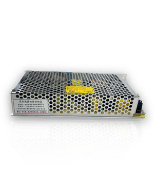 Meanwell 120W 5A 24V 5A Meanwell Power Supply - a silver rectangular metal unit with a perforated casing and a yellow input voltage selection switch label.