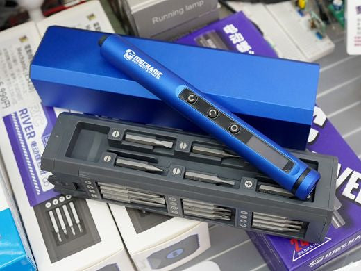 Mechanic Electric Screwdriver ES420 Price - shown with a blue cylindrical handle featuring three buttons, resting on its grey storage case containing various bits.