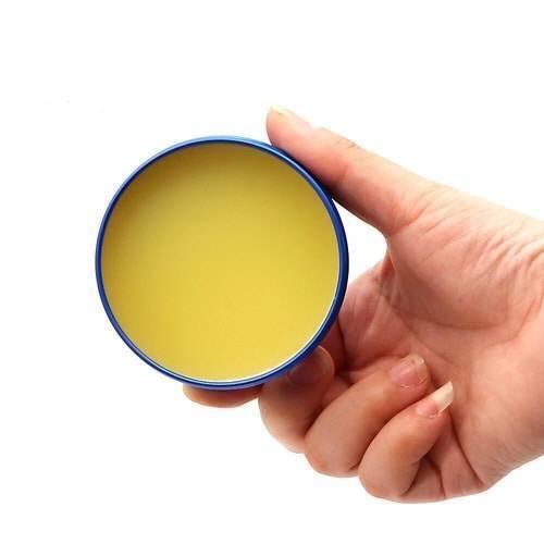 Mechanic No Clean BGA Tin Solder Flux Paste MCN-UV80 - shown as a yellow paste inside an open blue circular tin held in a person's hand.