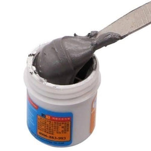 Mechanic Soldering Flux Paste 35gram Soldering Tin Mcn 300 Solder Welding Cream SN63 PB37 XG50 - shown in a white plastic jar with a metal spatula scooping out a portion of the grey solder paste.