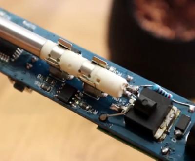 Mechanic Soldering Iron Bit Ot-i For T12 Soldering Stations - a close-up of the white ceramic heating element mounted on a blue circuit board.