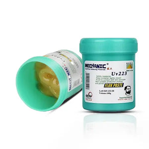MECHANIC UV 223 HALOGEN FREE FLUX PASTE - Soldering Flux - two turquoise cylindrical plastic jars of Mechanic UV223 flux paste, one standing upright with a lid and one lying on its side revealing thick yellow paste.
