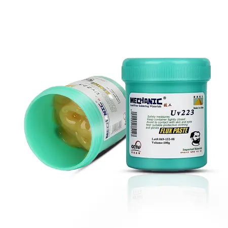 MECHANIC UV 223 HALOGEN FREE FLUX PASTE - Soldering Flux - two turquoise cylindrical plastic jars of Mechanic UV223 flux paste, one standing upright with a lid and one lying on its side revealing thick yellow paste.