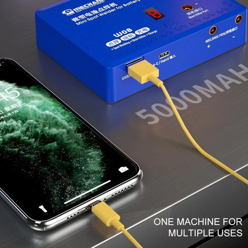 Mechanic W08 Mini Spot Welder - a USB-C cable connecting the device to a smartphone, with visible ports and a digital display.