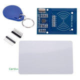 MFRC522 RC522 RFID Card Reader Writer Module - a blue circuit board, a white plastic card, a blue key fob, and two sets of header pins.