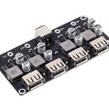 MH-KC24 4-channel DC-DC Buck Converter With QC3.0 Fast Charging - 6-32V To 3V/5V/9V/12V/24V - a black circuit board featuring a DC power jack, four USB-A output ports, and several capacitors and inductors.