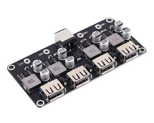 MH-KC24 4-channel DC-DC Buck Converter With QC3.0 Fast Charging - 6-32V To 3V/5V/9V/12V/24V - a black circuit board featuring a DC power jack, four USB-A output ports, and several capacitors and inductors.