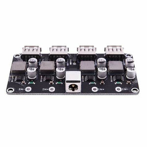 MH-KC24 4-channel DC-DC Buck Converter With QC3.0 Fast Charging - 6-32V To 3V/5V/9V/12V/24V - a black circuit board featuring four USB ports, a DC barrel jack, and multiple capacitors and inductors.