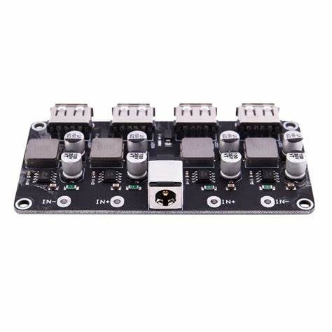 MH-KC24 4-channel DC-DC Buck Converter With QC3.0 Fast Charging - 6-32V To 3V/5V/9V/12V/24V - a black circuit board featuring four USB ports, a DC barrel jack, and multiple capacitors and inductors.