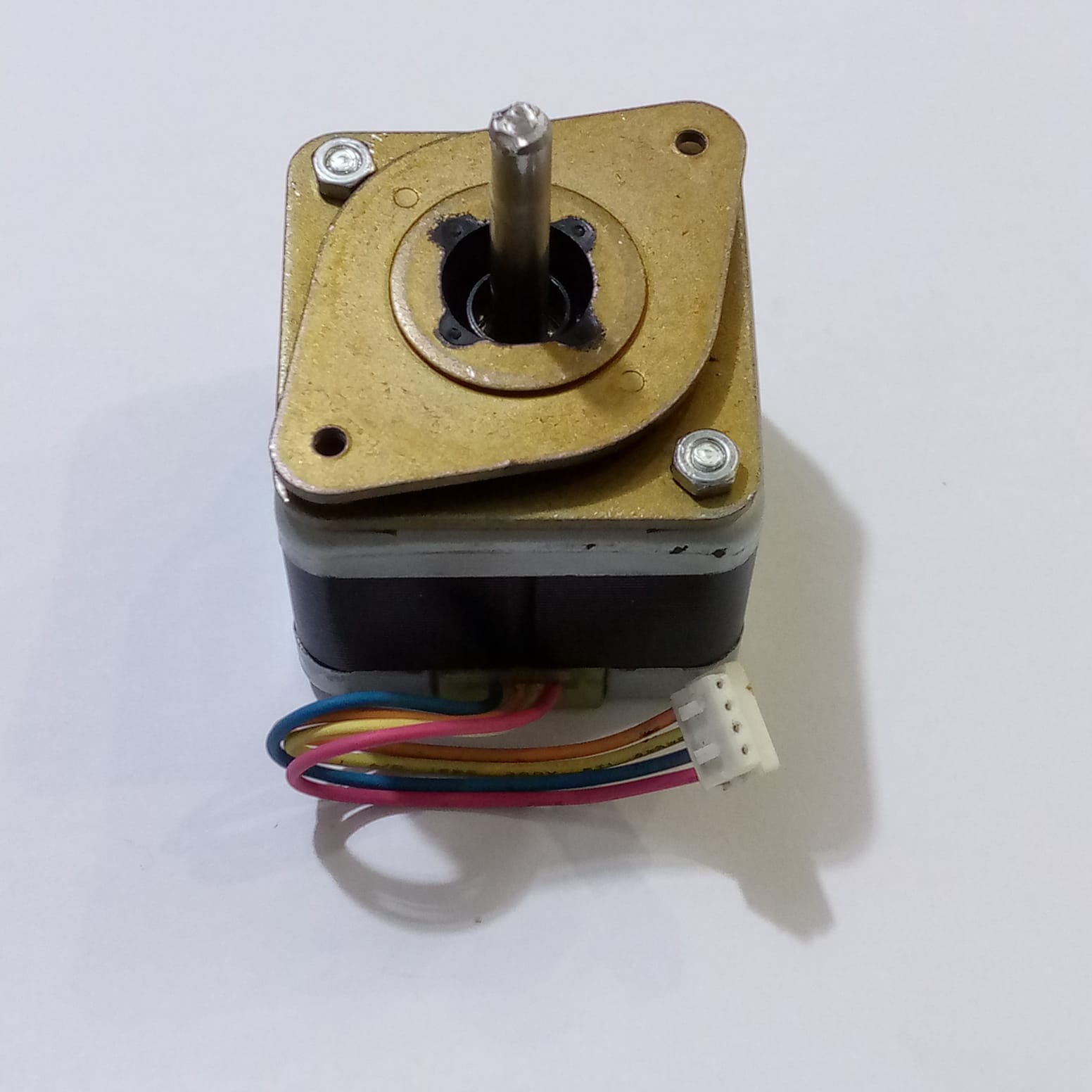 Minebea Bipolar 4 Wire Stepper Stepping Motor - a square-bodied motor with a metal shaft, a brass-coloured mounting plate, and a 4-pin white connector.
