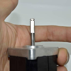 Minebea Japan d Cut Shaft NEMA 17 Stepper Motor For 3d Printer CNC - close-up view of the silver metal D-cut shaft held by a hand.
