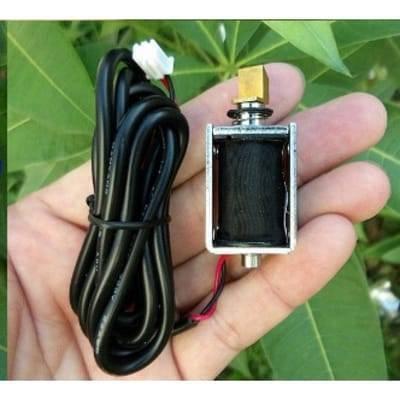 Mini 12V DC Electric Cabinet Door Lock Electromagnet Push Pull Type - a black solenoid coil with a metal frame, a brass plunger, and a black cable with a white connector.