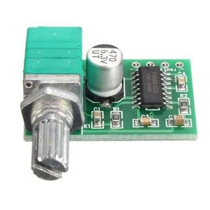 Mini 2 Channel Digital USB Audio Amplifier Board Module PAM8403 With Volume Control Potentionmeter - green circuit board, a silver volume control knob, and a cylindrical capacitor.