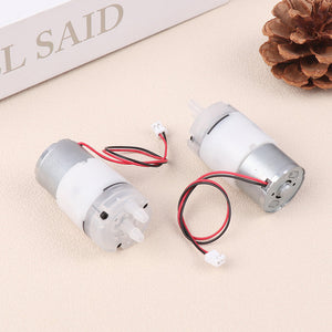 Mini 5V Water Pump Diaphragm Pump Micro Self Priming Suction Drinking Fountain Water Pump Water Dispenser Pump - two silver and white micro pumps with attached red and black wires featuring white connectors on a beige surface.