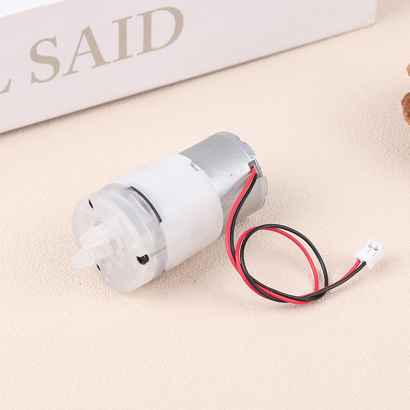 Mini 5V Water Pump Diaphragm Pump Micro Self Priming Suction Drinking Fountain Water Pump Water Dispenser Pump - a silver motor attached to a white plastic pump housing with two small nozzles and a red and black wire connector.