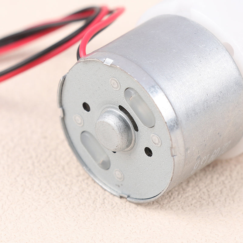 Mini 5V Water Pump Diaphragm Pump Micro Self Priming Suction Drinking Fountain Water Pump Water Dispenser Pump - close-up view of the cylindrical silver metal motor housing with two attached red and black power wires.