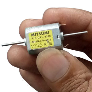 Mini Flat 030 Electric Motor DC 12V-24V 19500RPM Dual Axle Shaft - a silver metal body with a yellow label and two wire terminals.