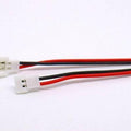 Mini Micro JST2.0 Losi 2.0mm 2-pin Connector Plug Male Female With Wire - two white plastic 2-pin connectors attached to red and black wires against a white background.