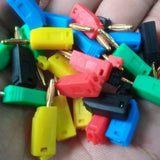 Mix Color 2mm Banana Plug For Electrical And Electronics Lab Trainers - shown as a scattered pile of assorted red, yellow, blue, green, and black connectors.
