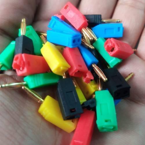 Mix Color 2mm Banana Plug For Electrical And Electronics Lab Trainers - shown as a handful of assorted red, yellow, blue, green, and black connectors.