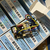 MK4T 5-24 Universal Adjustable Power Module - shown as a circuit board with attached coloured wires, resting on top of multiple branded product boxes.