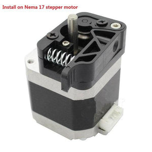 MK8/9 Dual Extruder Feed Device Part For 3d Printer 1.75mm Filament - 1( Right Side) - shown as a black and silver metal assembly installed on a Nema 17 stepper motor with a visible spring.