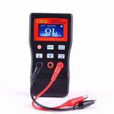 MLC500 Digital LC Meter - black meter with red screen and buttons, red and black crocodile test clips