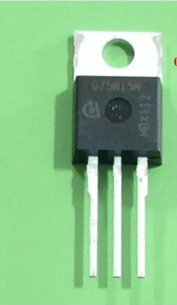 MOSFET 075N15N TO-220 ( USED ) ORIGNAL - a black three-pin electronic component with a metal tab and mounting hole, shown against a green background.